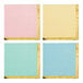 A group of Creative Converting square paper beverage napkins in pink, blue, and yellow with gold trim.