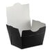 A black folded paper take-out box with a white lid.