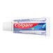 A close-up of a white Colgate toothpaste tube with blue and red labels.