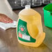 A plastic jug of Murphy Oil Soap Original on a table.