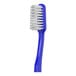 A close-up of a blue Colgate Soft Full Head Toothbrush with white bristles.