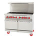 An American Range commercial stainless steel 8-burner range with storage base and red knobs.