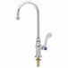 A silver deck-mount faucet with blue and gold wrist action handles.