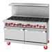 An American Range stainless steel 10-burner range with red knobs.