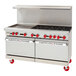 A large stainless steel American Range commercial gas range with red knobs on a counter.