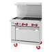 An American Range commercial gas range with 4 burners, a griddle, and a standard oven.
