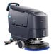 A Nilfisk SC550 floor scrubber with wheels and a handle.