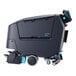 A black Nilfisk walk-behind cylindrical floor scrubber with wheels.