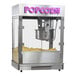 A Paragon countertop popcorn machine with a large container of popcorn.