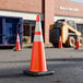 A 36-inch orange heavy-duty PVC traffic cone with a 10 lb. base and double high-intensity prismatic collars.