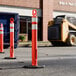 A 45-inch orange ring top delineator post with a 13 lb. base and double high-intensity prismatic collars, used for traffic or construction site safety.