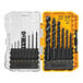 A Dewalt drill with a set of drill bits in a plastic case on a table in an outdoor patio.