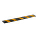 A 6-foot black and yellow rubber speed bump.
