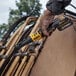 A hand holding a yellow and black DCF510B power tool.
