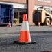 An 18-inch orange heavy-duty PVC traffic cone with a 3 lb. base and a single high-intensity prismatic reflective collar.