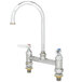 A silver T&S deck-mounted faucet with lever handles.