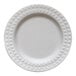 A close up of a white Jungle Decor sugarcane pulp plate with a diamond pattern.