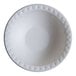 A white Jungle Decor sugarcane bowl with a diamond pattern.