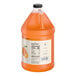A one-gallon jug of Hometown Provisions orange beverage concentrate.