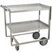A stainless steel Advance Tabco utility cart with two shelves and wheels.