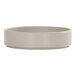 A round, light gray melamine plate with a raised rim.