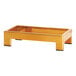 A gold rectangular Cal-Mil display riser with black legs.