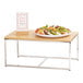A Cal-Mil rectangular chrome display stand with a plate of fruit on it.
