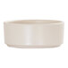 A small, ivory, straight-sided melamine ramekin.