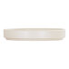 A round, ivory-colored, low-rim melamine plate.