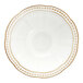 A white stoneware bowl with a scalloped edge and embossed pearl circle.