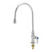 A silver T&S deck-mount faucet with a blue knob.