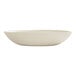 A large ivory melamine pasta bowl with a smooth, slightly irregular shape.