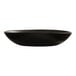 A large black melamine pasta bowl with a smooth, slightly irregular shape.