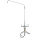 A silver T&S deck mounted pantry faucet with flex inlets and a hose.