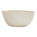 A beige melamine soup bowl with a smooth, slightly irregular shape.