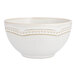 A white Mannette Perls stoneware bowl with an embossed pearl edge.