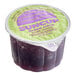 A close-up of a purple SunCup container of grape juice.