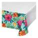 A table with a Tropic Time tablecloth with a floral pattern.