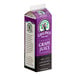 A purple and white carton of grape juice concentrate with a label.
