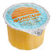 A close up of a SunCup container of orange juice.