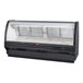 A Howard McCray black refrigerated red meat case with curved glass doors.