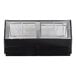 A black Howard McCray curved glass refrigerated red meat case with glass windows.