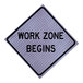 A close up of a Cortina Quadraflex "Work Zone Begins" roll-up sign with black lettering on a white background.