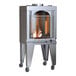 A Wood Stone vertical rotisserie oven with a fire inside.