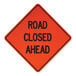 A close-up of a Cortina Quadraflex "Road Closed Ahead" sign with a white background and black letters.