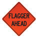 A white and black Cortina Quadraflex sign that says "Flagger Ahead" with a red diamond shape.