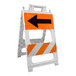 A white plastic barricade with an orange reflective panel featuring a black left-pointing arrow and diagonal orange and white stripes.