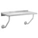 An Advance Tabco stainless steel wall mounted table with two metal pipes underneath.