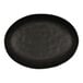 A matte black oval Cal-Mil melamine tray with a black rim.