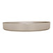 A taupe-colored, round melamine plate with a raised rim.